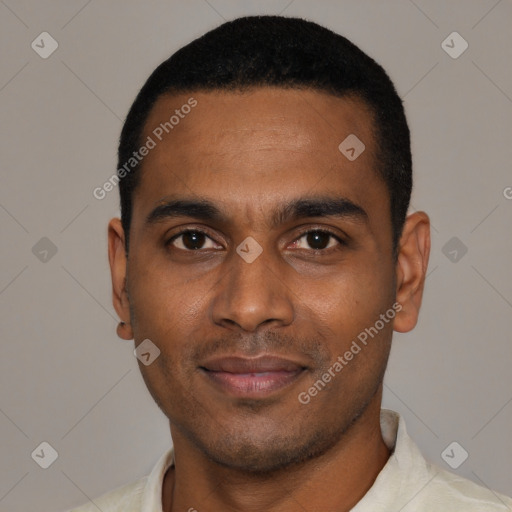 Joyful black young-adult male with short  black hair and brown eyes