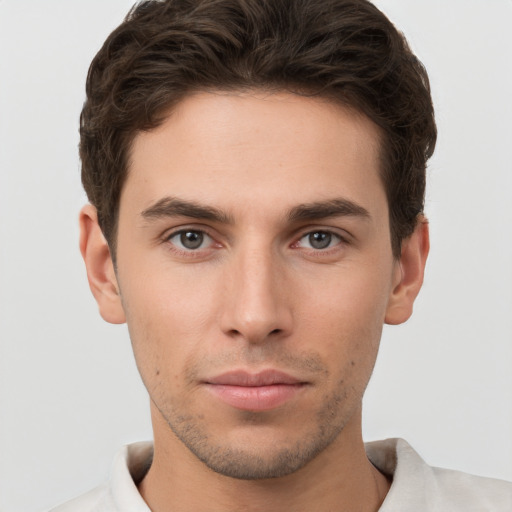 Neutral white young-adult male with short  brown hair and brown eyes