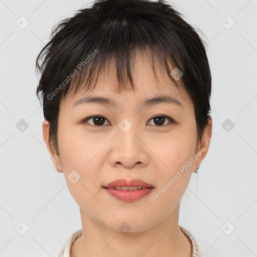 Joyful asian young-adult female with short  brown hair and brown eyes