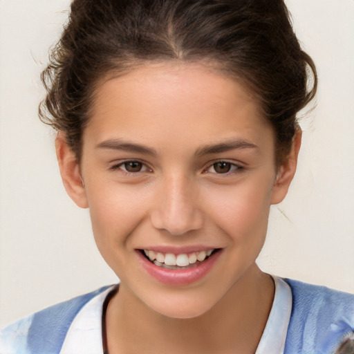 Joyful white child female with short  brown hair and brown eyes