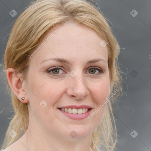 Joyful white adult female with medium  brown hair and blue eyes