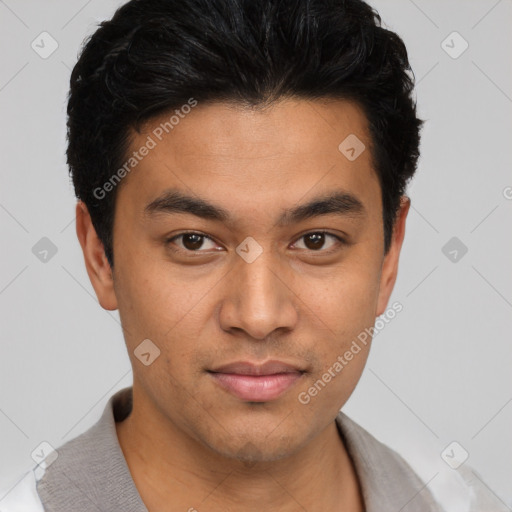 Joyful asian young-adult male with short  black hair and brown eyes