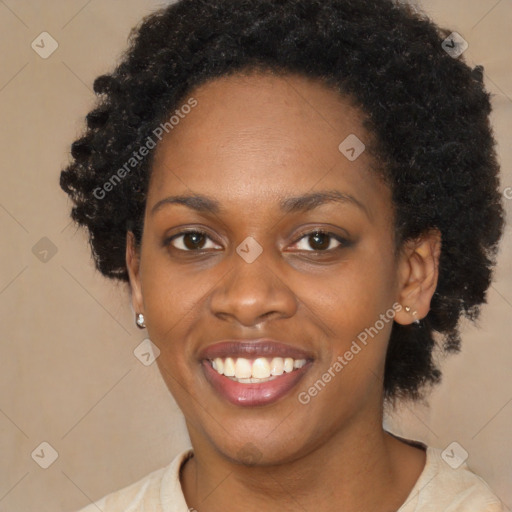 Joyful black young-adult female with short  black hair and brown eyes