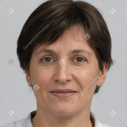 Joyful white adult female with short  brown hair and brown eyes