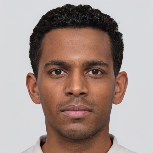 Neutral black young-adult male with short  black hair and brown eyes