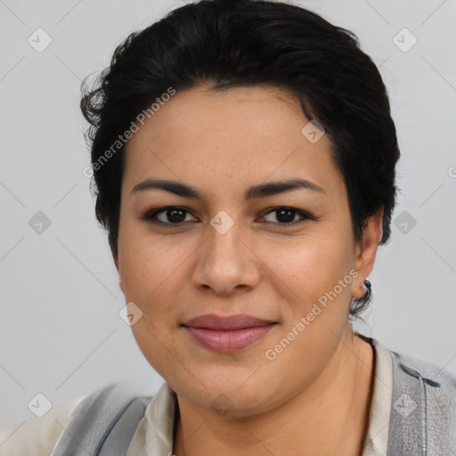 Joyful latino young-adult female with short  brown hair and brown eyes