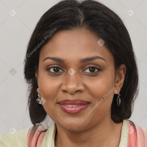 Joyful black young-adult female with long  brown hair and brown eyes