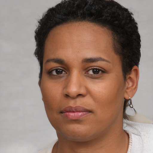 Neutral latino young-adult female with short  brown hair and brown eyes