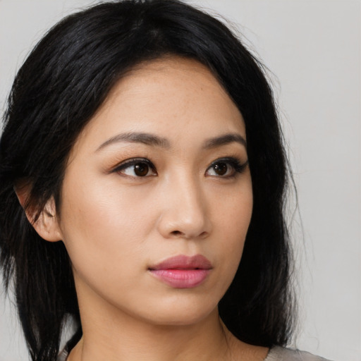 Neutral latino young-adult female with medium  black hair and brown eyes
