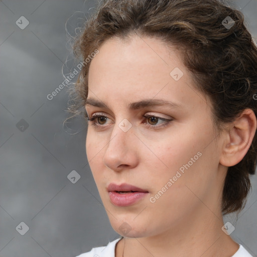 Neutral white young-adult female with medium  brown hair and brown eyes