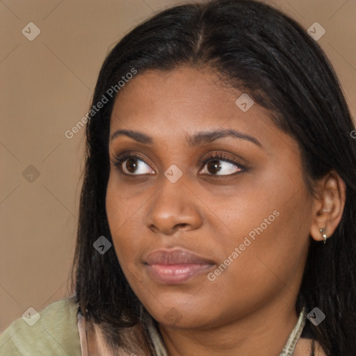 Joyful black young-adult female with medium  brown hair and brown eyes