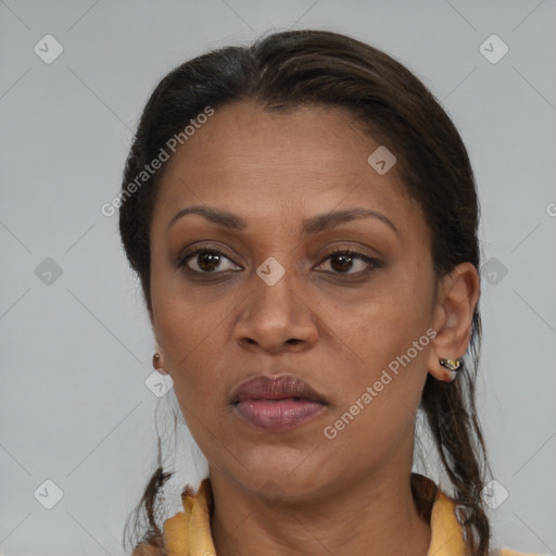 Joyful black adult female with medium  brown hair and brown eyes