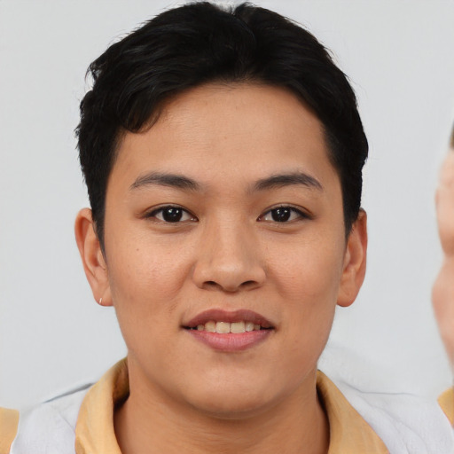 Joyful asian young-adult female with short  brown hair and brown eyes