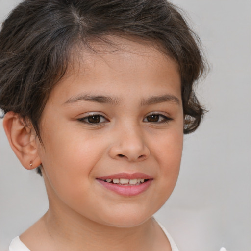 Joyful white child female with short  brown hair and brown eyes