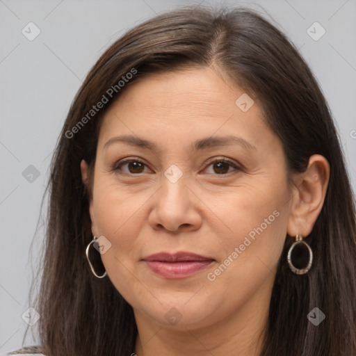 Joyful white adult female with long  brown hair and brown eyes