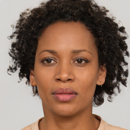 Neutral black adult female with medium  brown hair and brown eyes