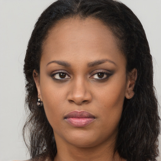 Neutral black young-adult female with long  brown hair and brown eyes