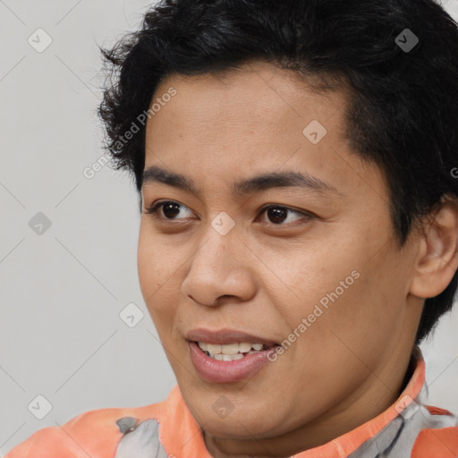Joyful asian young-adult female with short  brown hair and brown eyes