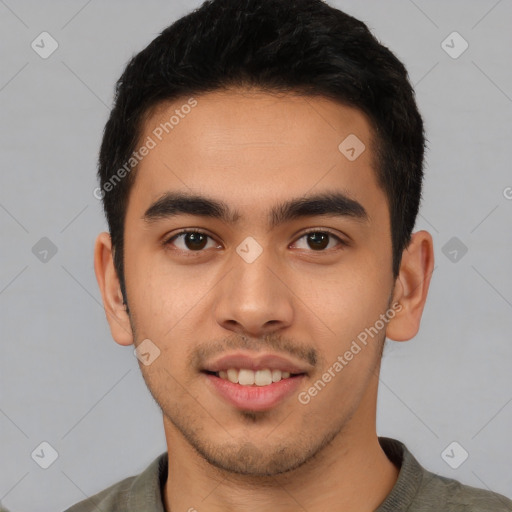 Joyful latino young-adult male with short  brown hair and brown eyes