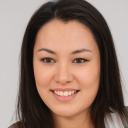 Joyful asian young-adult female with long  brown hair and brown eyes