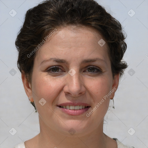 Joyful white adult female with short  brown hair and brown eyes