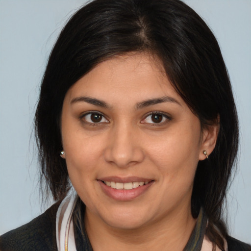 Joyful white young-adult female with medium  brown hair and brown eyes