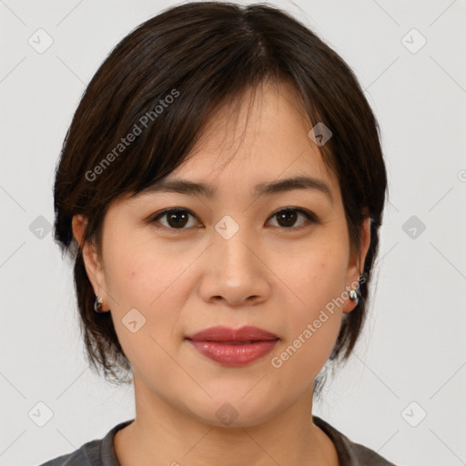 Joyful asian young-adult female with medium  brown hair and brown eyes