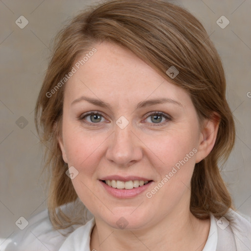 Joyful white young-adult female with medium  brown hair and blue eyes