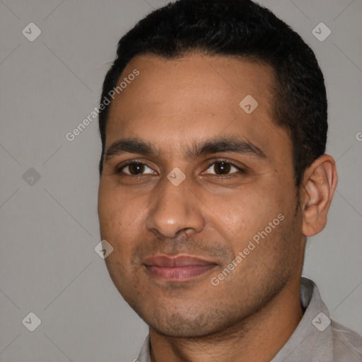 Joyful latino young-adult male with short  black hair and brown eyes