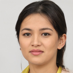 Joyful asian young-adult female with medium  brown hair and brown eyes