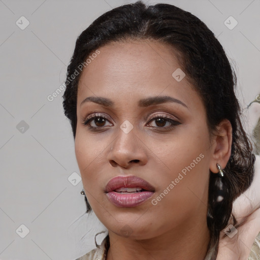 Joyful black young-adult female with medium  brown hair and brown eyes