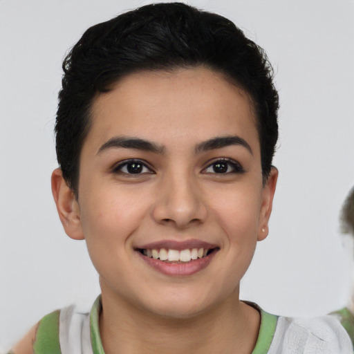 Joyful latino young-adult female with short  brown hair and brown eyes