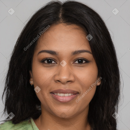 Joyful black young-adult female with long  brown hair and brown eyes