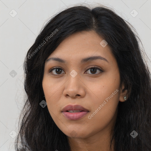 Joyful asian young-adult female with long  black hair and brown eyes