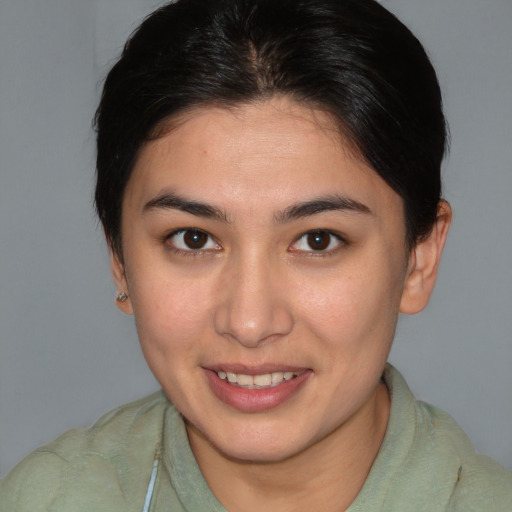 Joyful white young-adult female with medium  brown hair and brown eyes