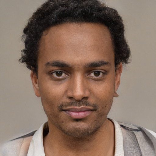Neutral latino young-adult male with short  brown hair and brown eyes
