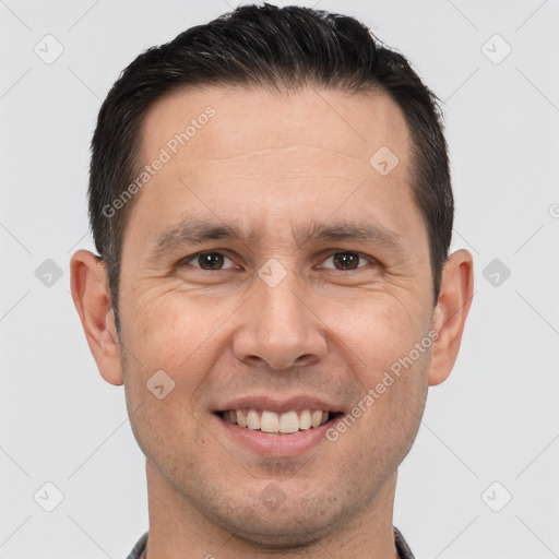 Joyful white adult male with short  brown hair and brown eyes