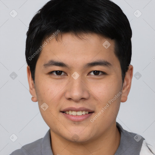 Joyful asian young-adult male with short  black hair and brown eyes