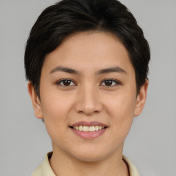 Joyful asian young-adult female with short  brown hair and brown eyes