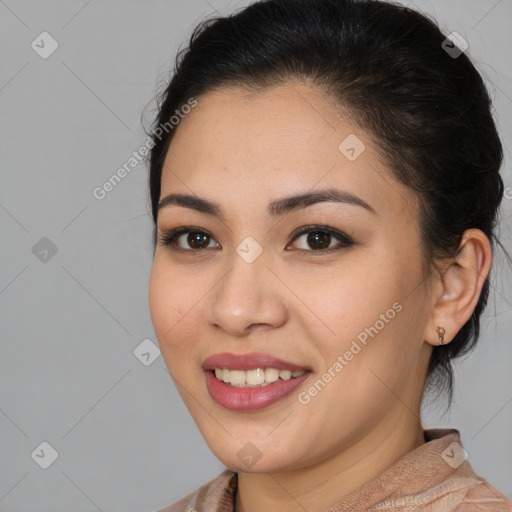 Joyful latino young-adult female with medium  brown hair and brown eyes