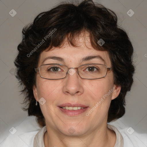 Joyful white adult female with medium  brown hair and blue eyes