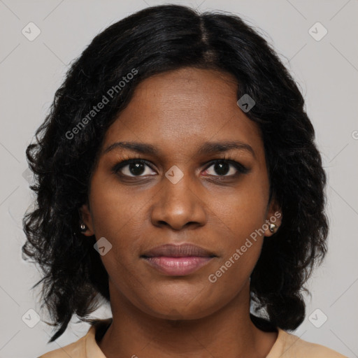 Joyful black young-adult female with long  brown hair and brown eyes