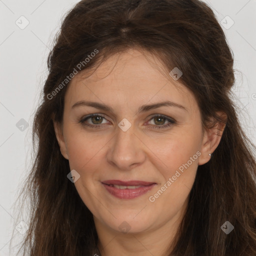 Joyful white adult female with long  brown hair and brown eyes