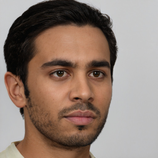 Neutral latino young-adult male with short  black hair and brown eyes