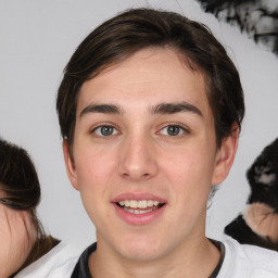 Joyful white young-adult male with medium  brown hair and brown eyes