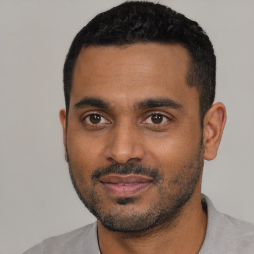 Neutral black young-adult male with short  black hair and brown eyes