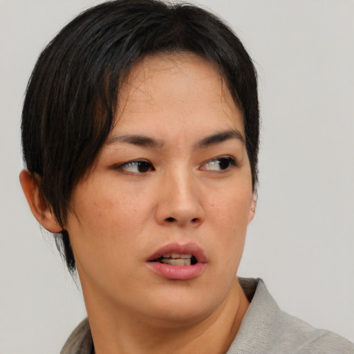 Neutral asian young-adult female with short  brown hair and brown eyes