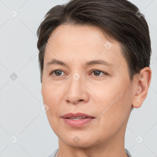 Joyful white adult female with short  brown hair and brown eyes