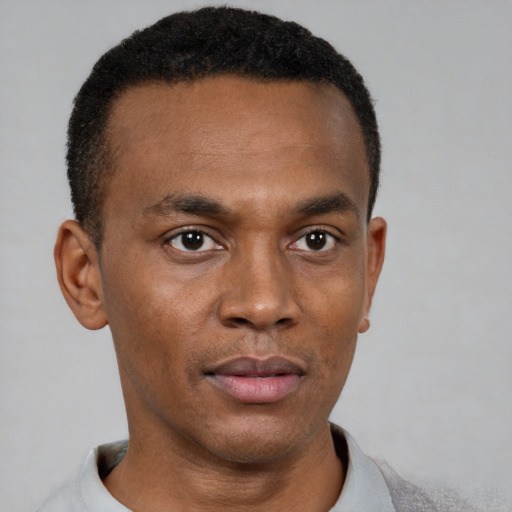 Neutral black young-adult male with short  black hair and brown eyes