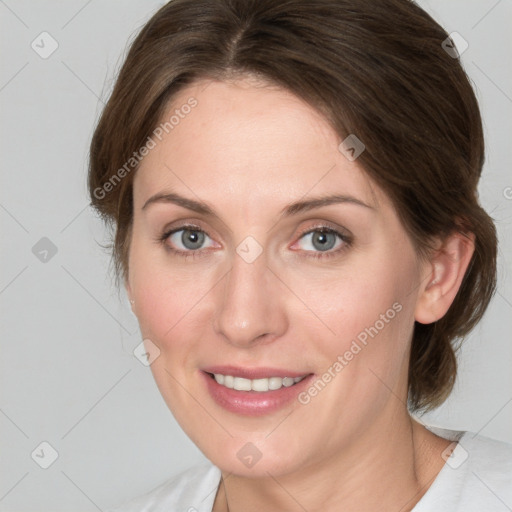 Joyful white young-adult female with medium  brown hair and blue eyes